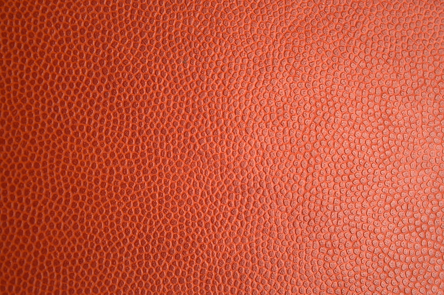 Close-up of textured red leather surface with pebbled grain pattern