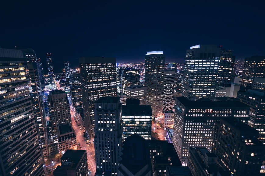 Aerial Night View of Metropolitan City Skyline with Illuminated Skyscrapers