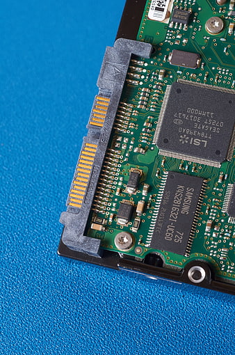 Close-up of Hard Drive Circuit Board on Blue Background