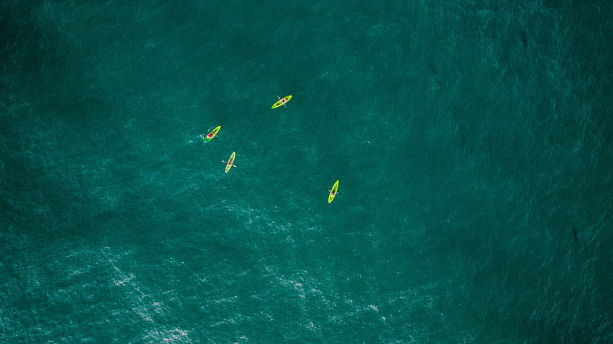 Aerial View of Kayakers on Turquoise Ocean Water