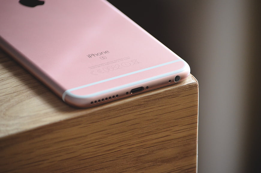 Close-up of Rose Gold iPhone 6s on Wooden Surface
