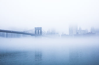 Brooklyn Bridge in Thick Fog with City Skyline