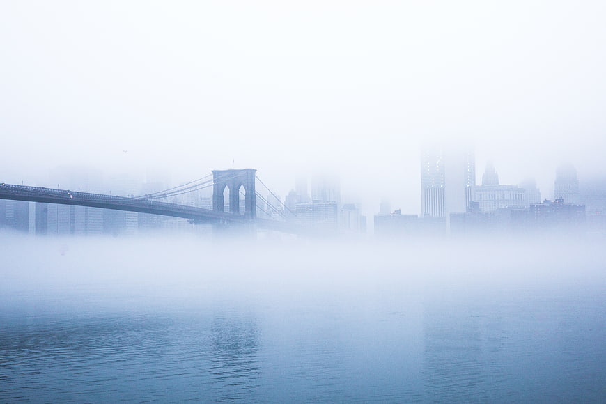 Brooklyn Bridge in Thick Fog with City Skyline