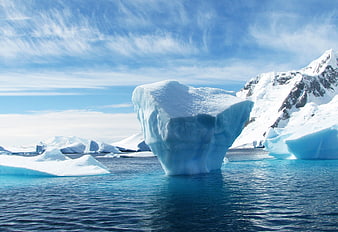 Massive Blue Iceberg Floating in Antarctic Waters