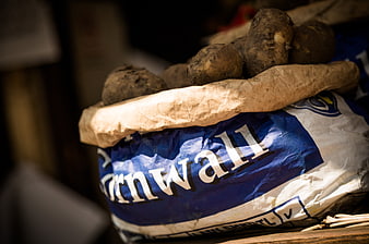 Close-up of potatoes in a blue and white sack