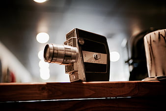 Vintage Keystone Movie Camera on Wooden Shelf