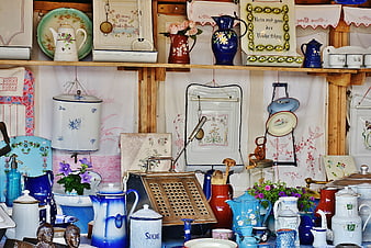 Vintage kitchenware and antiques at a flea market stall