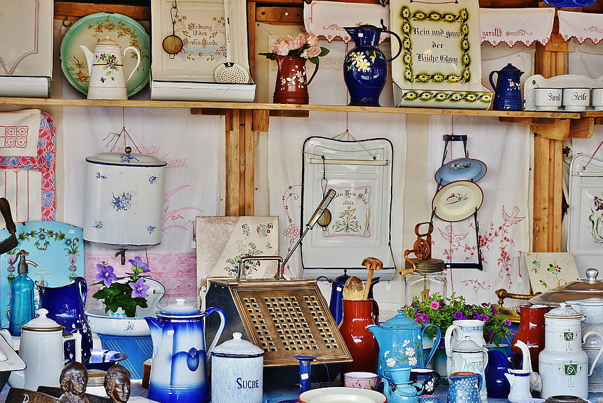 Vintage kitchenware and antiques at a flea market stall