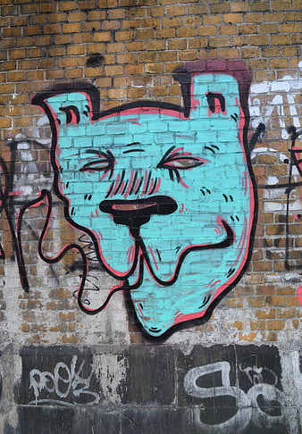Turquoise Cat Graffiti on Brick Wall