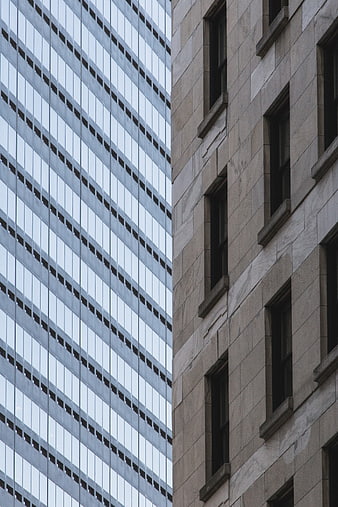 Contrasting Modern Glass and Stone Skyscraper Facades