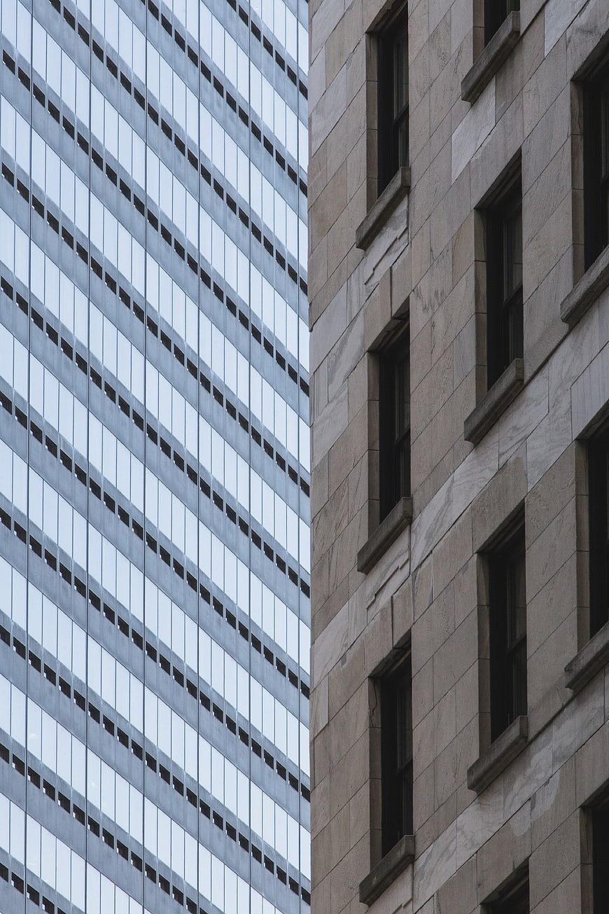 Contrasting Modern Glass and Stone Skyscraper Facades
