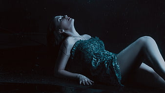Woman in Wet Lace Dress Lying in Rain