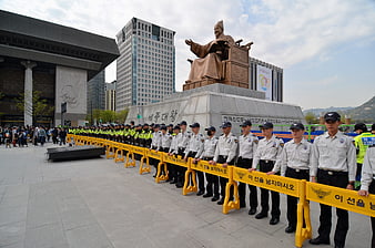Korean Police Line Standing Guard In Front Of Seoul Statue