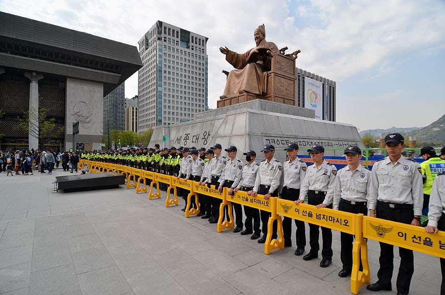Korean Police Line Standing Guard In Front Of Seoul Statue