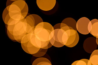 Abstract golden bokeh lights on black background