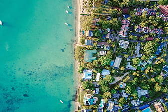 Aerial View of Tropical Beach with Turquoise Water and Villas