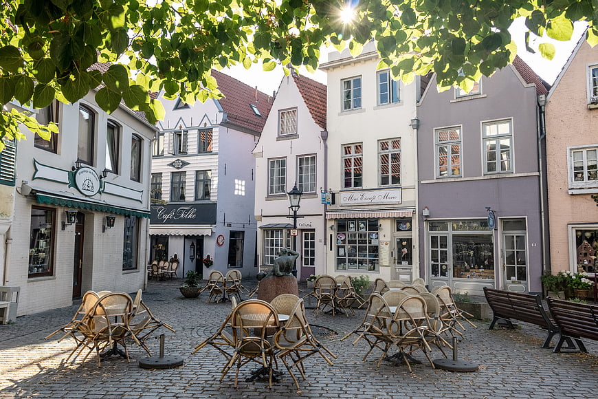 Historic European Town Square With Colorful Buildings And Outdoor Cafe Seating