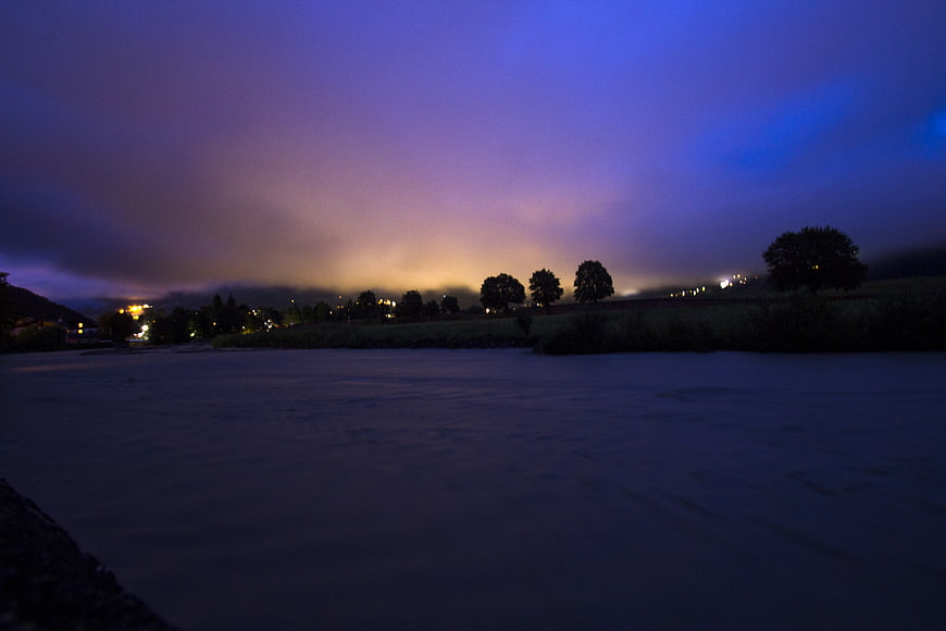 River in Bormio, Italy at Night with City Lights