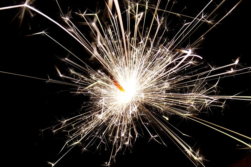 Bright Sparkler Bursting Against Black Night Background