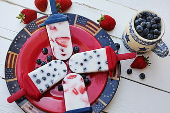 Patriotic Fruit Popsicles On Red Plate With Berries