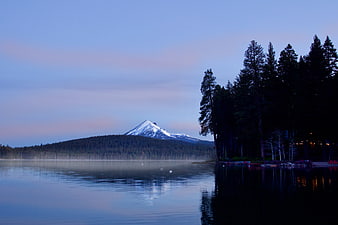 Serene Lake View with Snow-Capped Mountain at Dusk