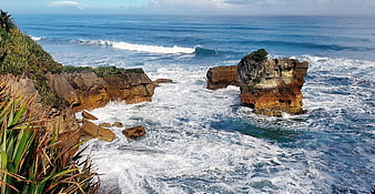 Dramatic Coastal Sea Stack with Crashing Waves and Cliffs