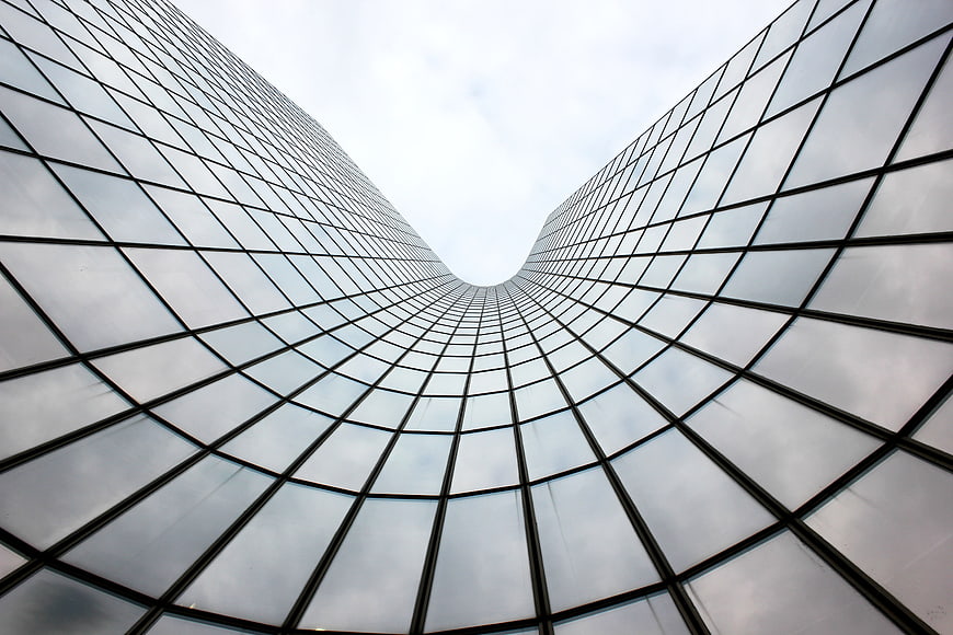 Low angle view of modern glass skyscraper architecture