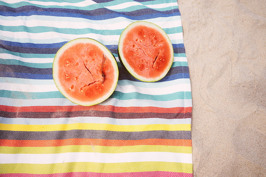 Sliced Watermelon on Striped Beach Towel