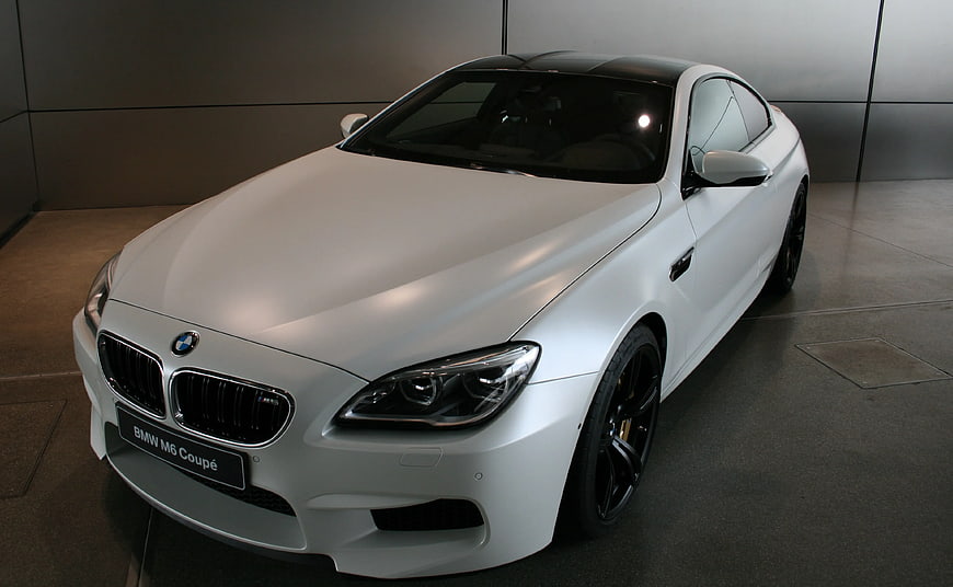 White BMW M6 Coupe in Modern Showroom