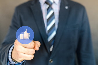 Businessman Pressing Blue Facebook Like Icon