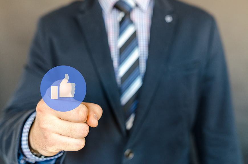 Businessman Pressing Blue Facebook Like Icon