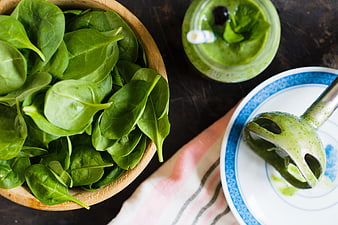 Fresh spinach smoothie ingredients and immersion blender top view