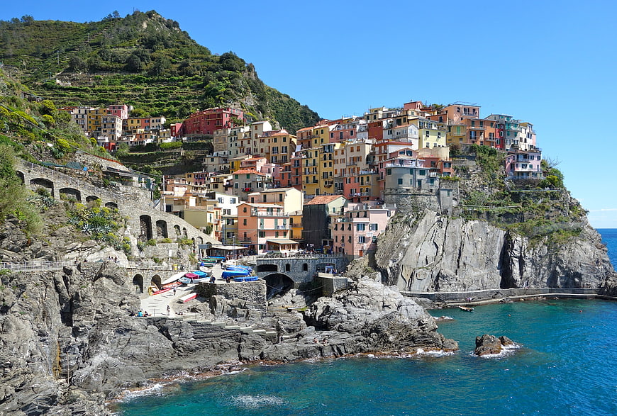 Colorful coastal village on rocky cliffs overlooking the sea