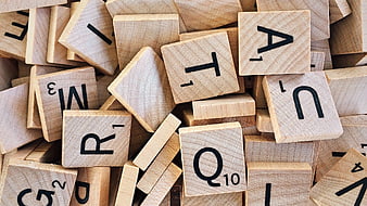 Scattered Wooden Scrabble Tiles Close-Up
