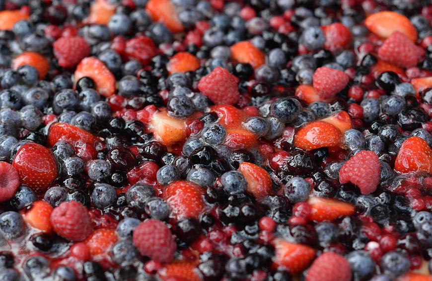 Close-up of mixed forest berries in syrup