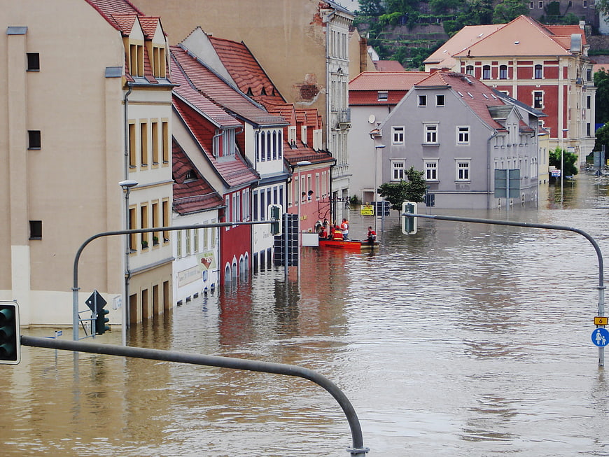 Flooded European Street with Rescue Boat and Submerged Buildings
