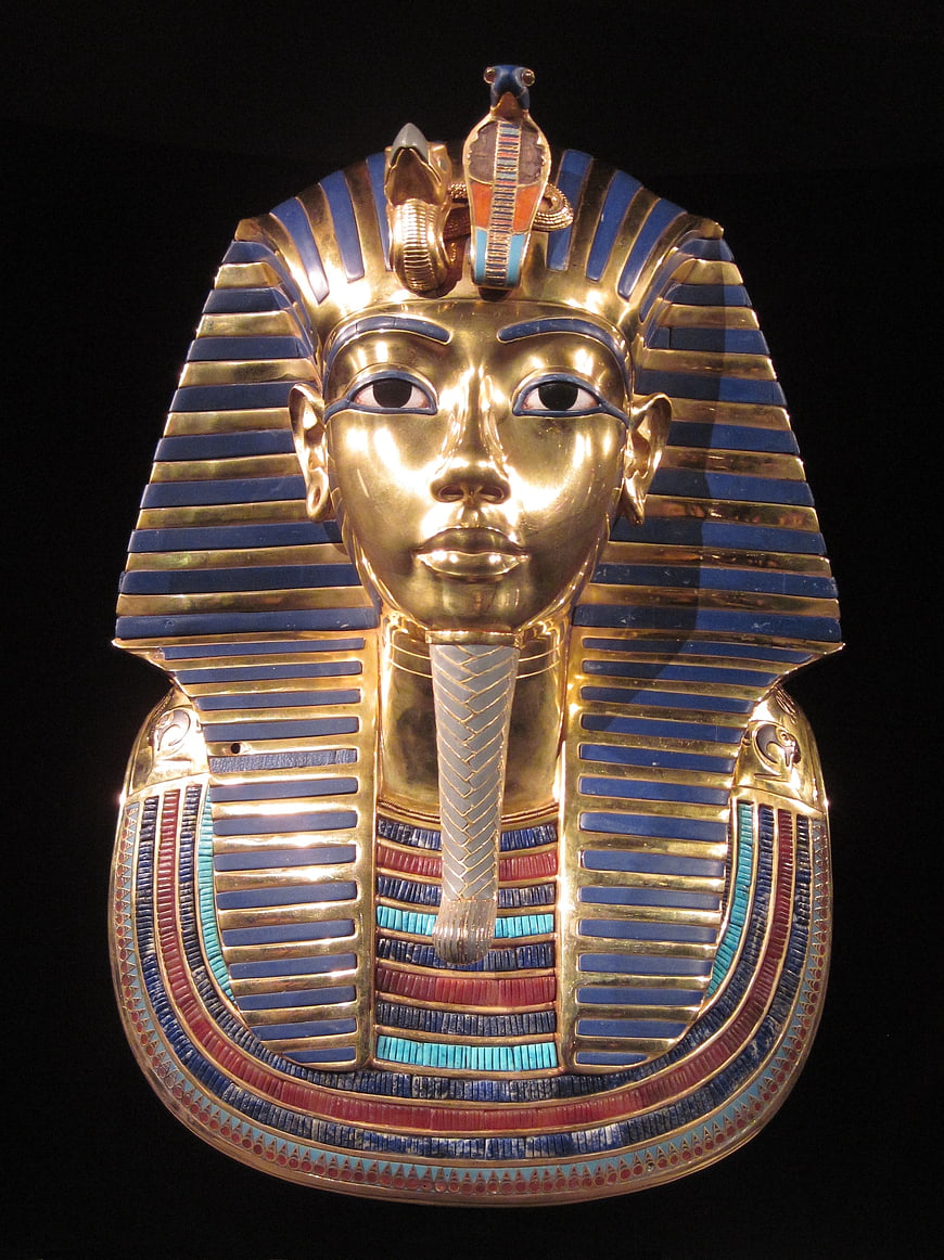 Golden Mask of Tutankhamun against Black Background