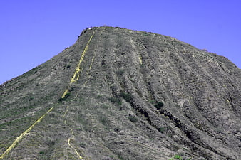 Rugged Mountain Peak with Yellow Hiking Trail Markers