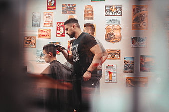 Barber Giving Men's Haircut In Vintage Barbershop