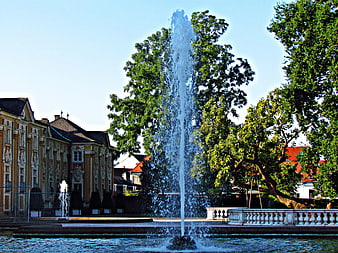 Water fountain in front of a baroque palace