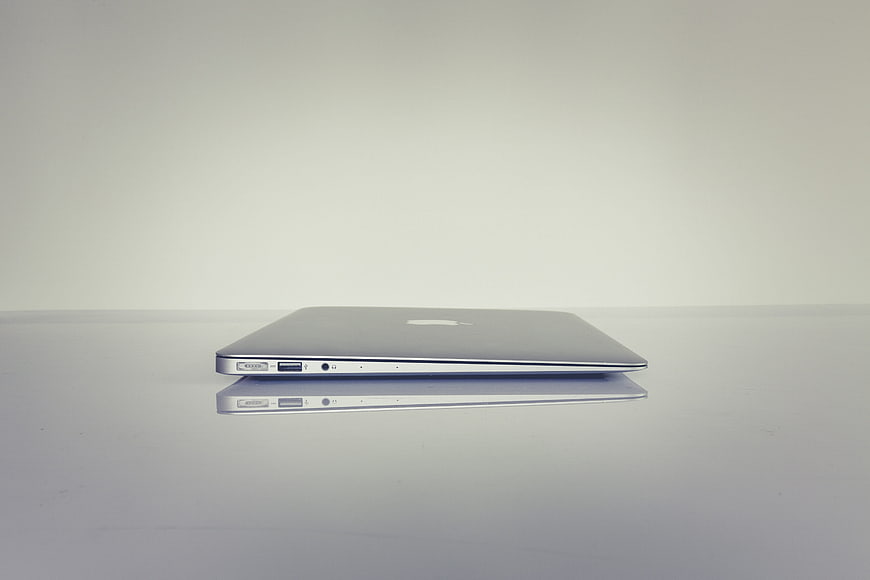 Minimalist Silver Laptop Side Profile On White Surface