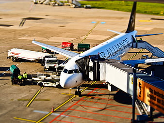 Tilt-shift view of Balli Air aircraft at airport gate
