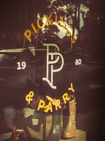 Vintage Boutique Window Display with Boots and Reflections