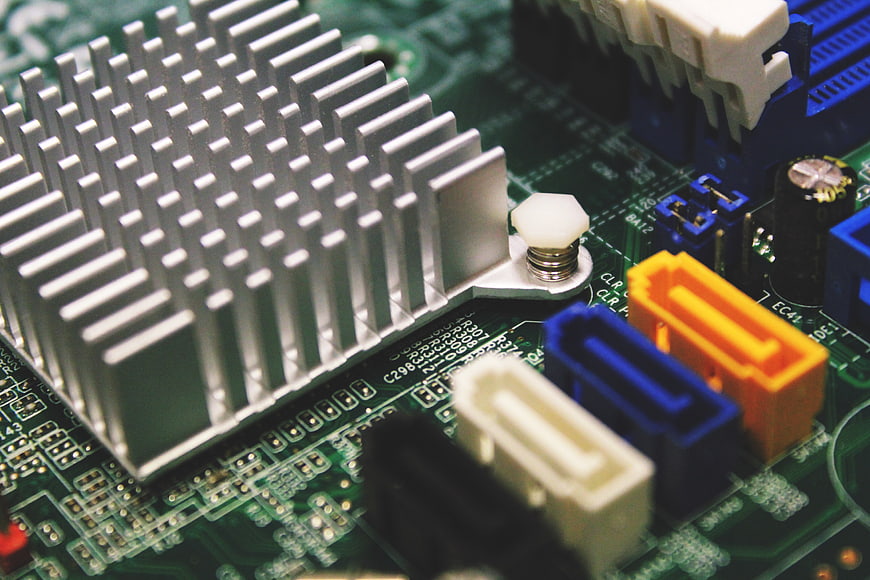 Close-up of Computer Motherboard with Heatsink and Connectors