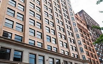 Low angle view of urban apartment building facade