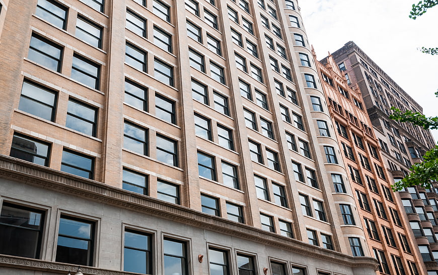 Low angle view of urban apartment building facade