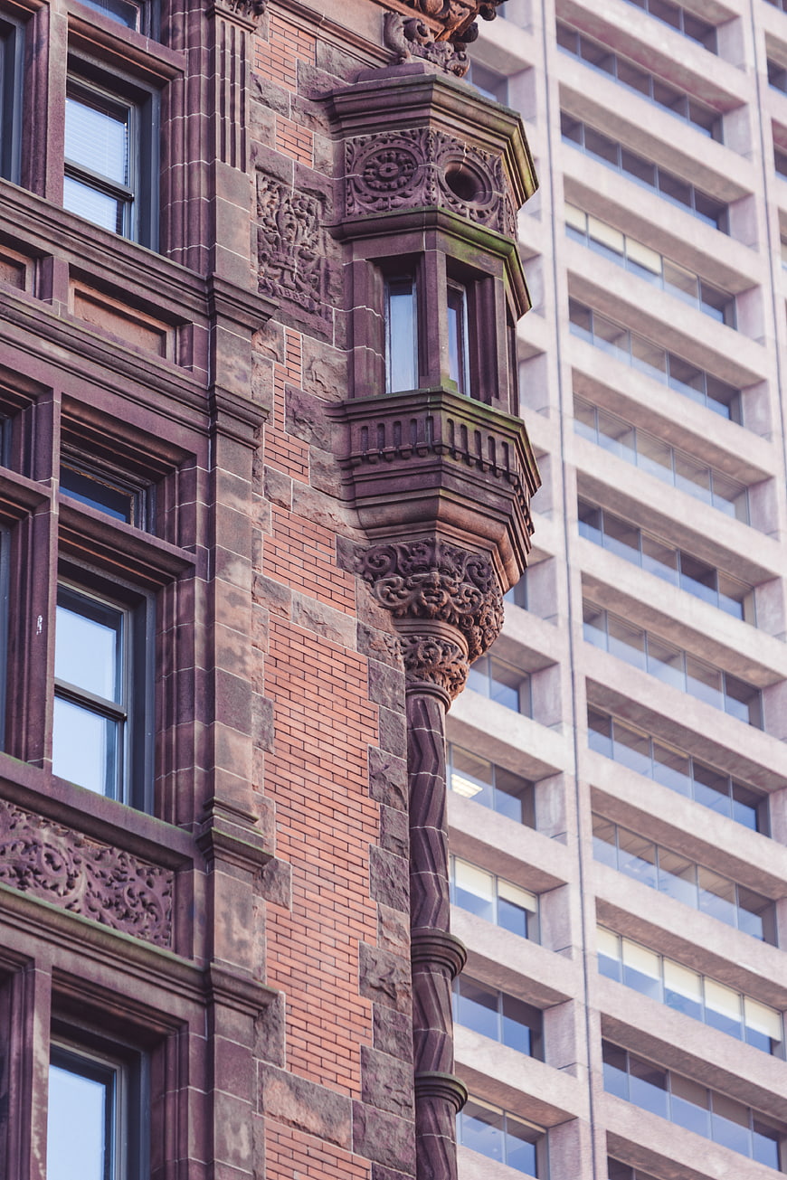Ornate Historic Building Facade with Modern Architecture Background