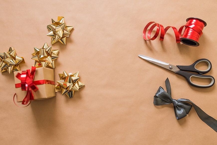 Christmas Gift Wrapping Supplies on Kraft Paper Background