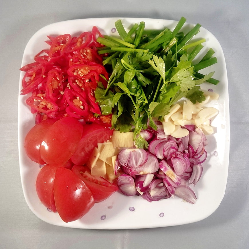 Fresh chopped vegetables on white plate for cooking