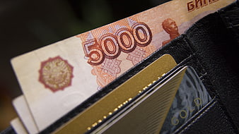 Close-up of 5000 Russian Rubles and Gold Card in Black Leather Wallet